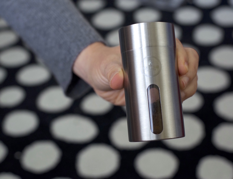 Ground coffee inside the bottom container