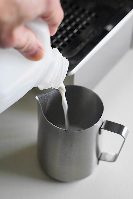 pouring milk for flat white