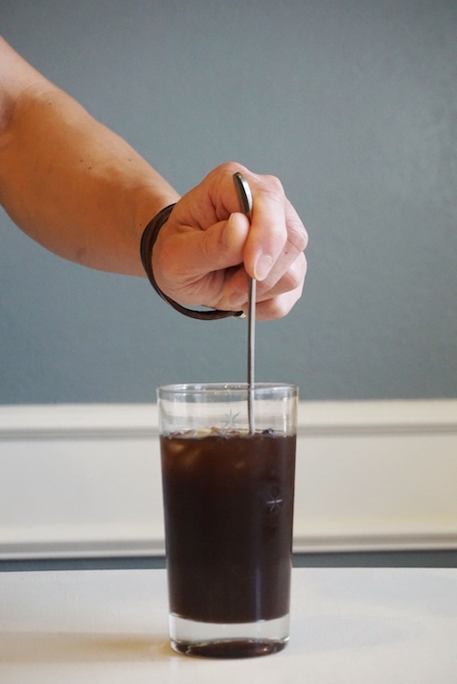 stirring cayenne pepper iced coffee